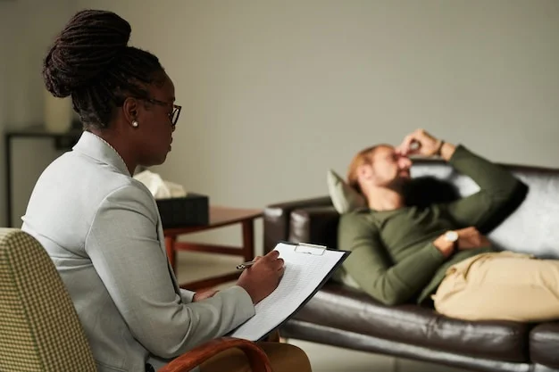 Veteran showing emotional distress while a therapist offers comfort during a PTSD session